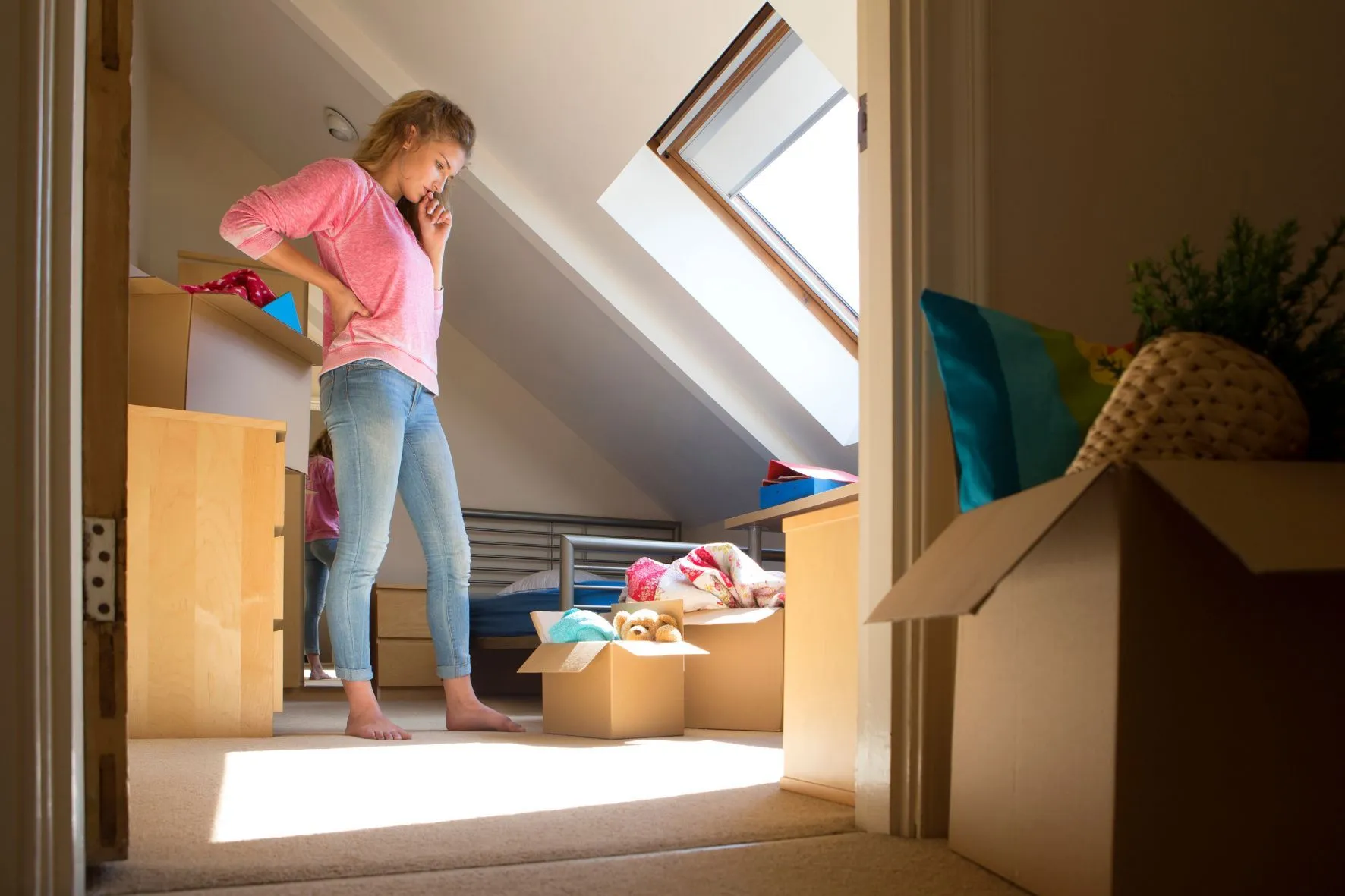 College student packing belongings