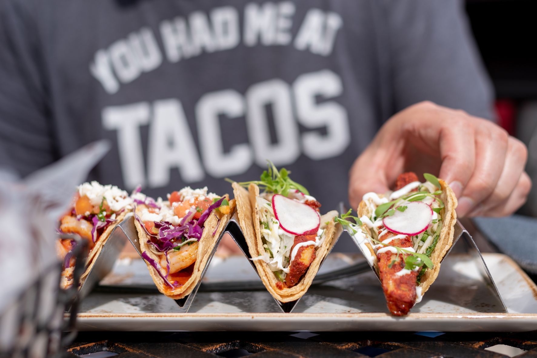 person eating tacos in coral springs florida