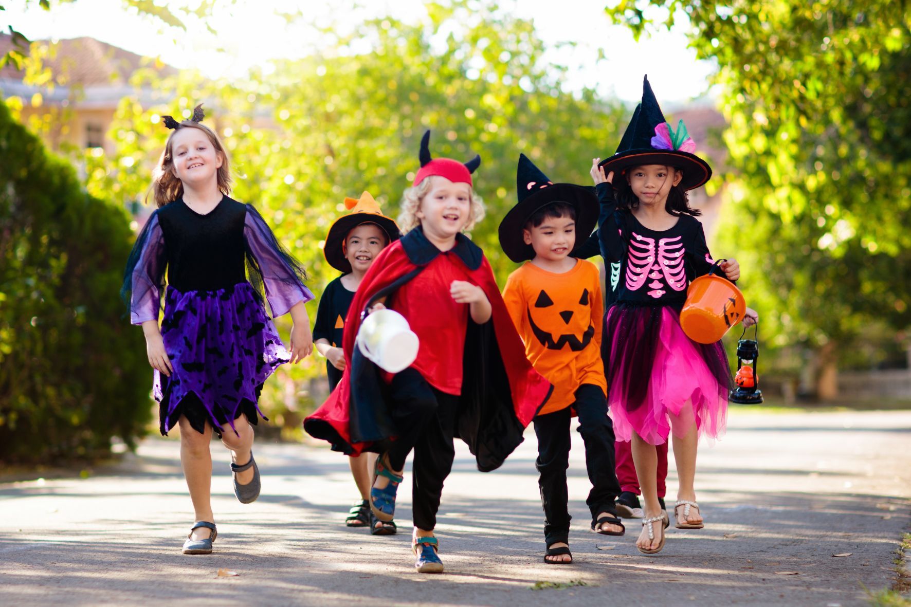 Kids trick or treating wearing halloween costumes in florida