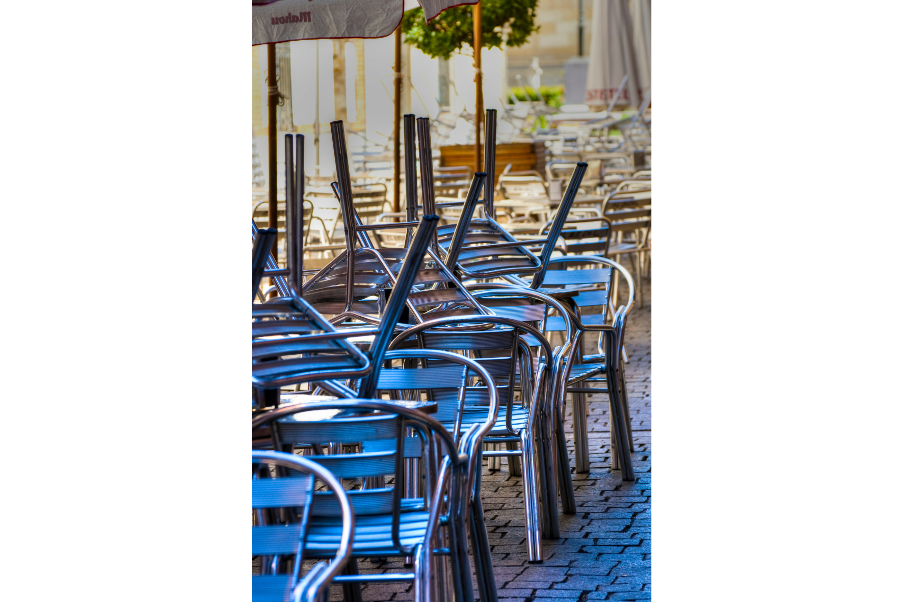 Stacked chairs outside restaurant