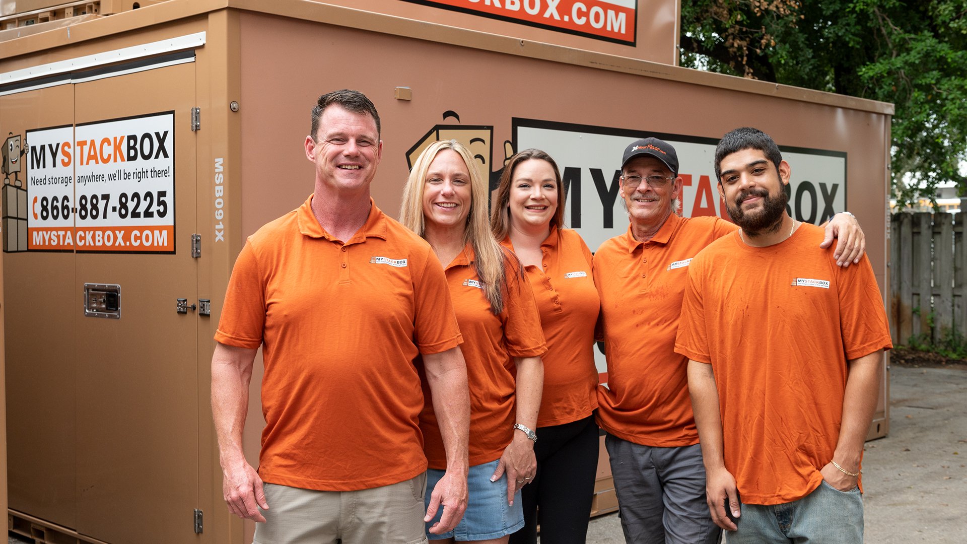 The My Stack Box team in front of a portable storage pod