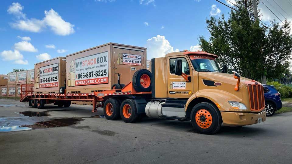 My Stack Box pods being delivered by a truck