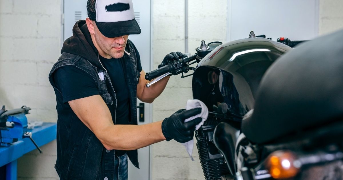 Man cleaning motorcycle in Florida