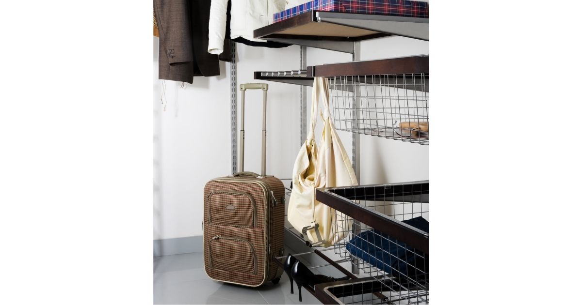 Suitcase stored under shelves