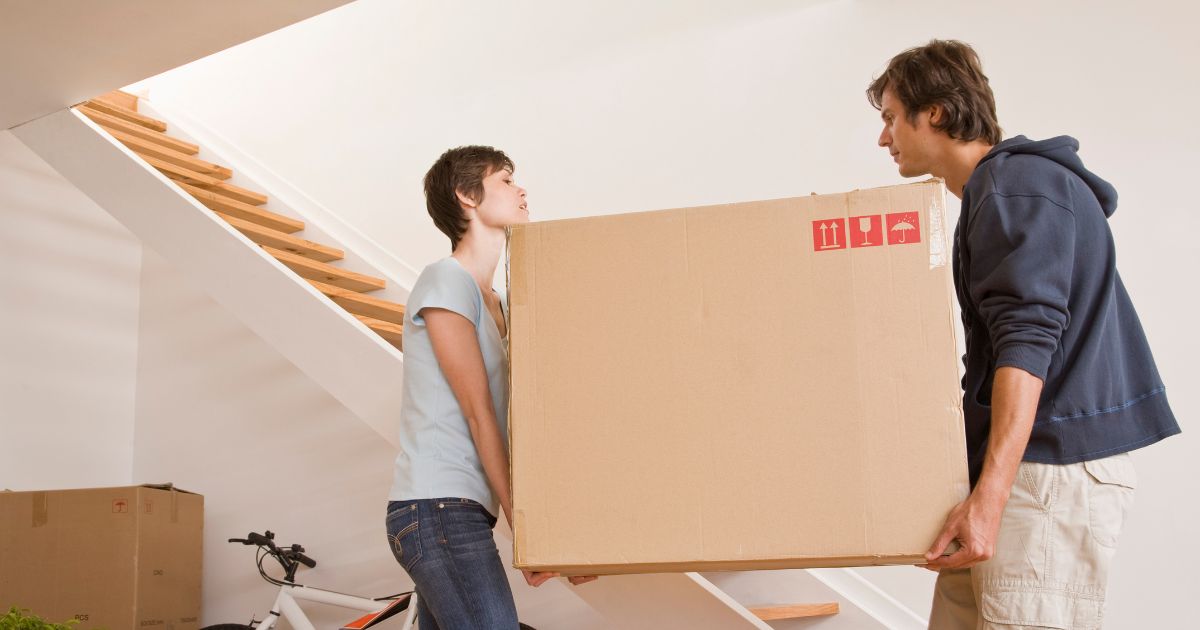 People moving a heavy box