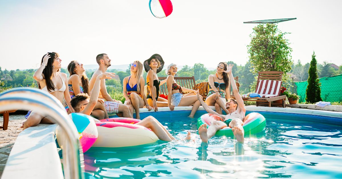 People in pool with inflatables