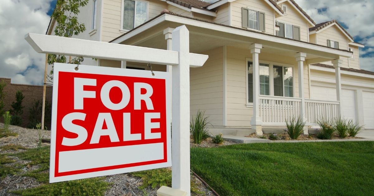 Home with for sale sign