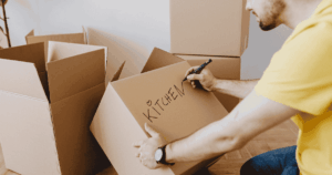 person packing moving boxes